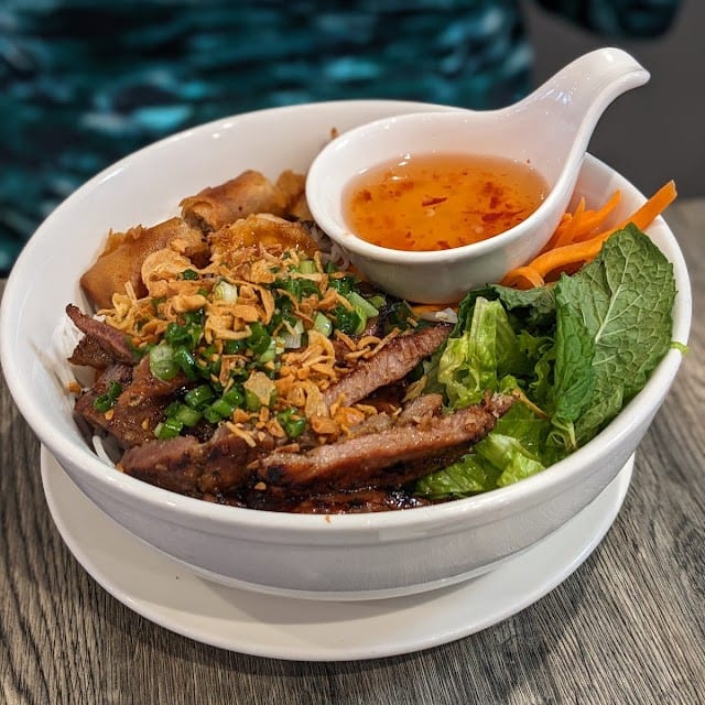 G1. Combo Grilled (Beef, Pork, or Chicken) and Egg Rolls Rice or Vermicelli Noodle.